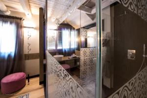 a bathroom with a walk in shower and a sink at Podere La Torre in Schio