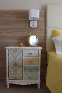 Postel nebo postele na pokoji v ubytování Apart-Hotel la Rocchetta