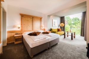 En eller flere senge i et værelse på Hotel Restaurant Kirchsteiger
