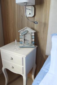 Postel nebo postele na pokoji v ubytování Apart-Hotel la Rocchetta