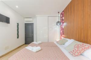 A bed or beds in a room at Villa Diagonal