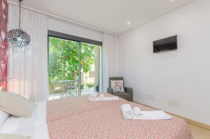 A bed or beds in a room at Villa Diagonal