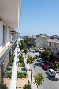 a view of a street from the balcony of a building at Olympic Coast in Olympic Beach