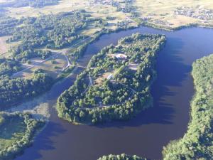 an aerial view of a group of islands in a river at Kempingas "Obuolių sala" in Molėtai