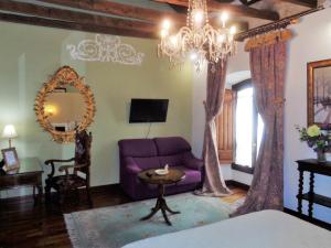 TV a/nebo společenská místnost v ubytování Hotel Boutique Nueve Leyendas