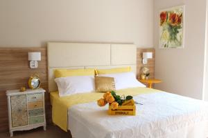 Postel nebo postele na pokoji v ubytování Apart-Hotel la Rocchetta