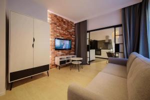 Televízia a/alebo spoločenská miestnosť v ubytovaní Boogie Apartments