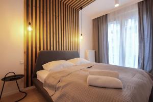 Posteľ alebo postele v izbe v ubytovaní Boogie Apartments