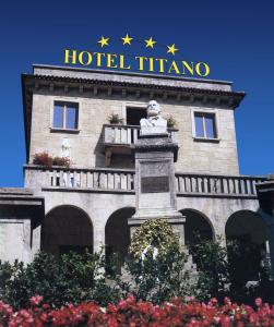 a hotel with a sign on top of a building at Hotel Titano in San Marino