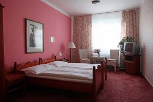 Voodi või voodid majutusasutuse Hotel Solaster Garni toas
