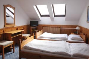 Voodi või voodid majutusasutuse Hotel Solaster Garni toas