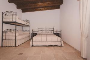 Voodi või voodid majutusasutuse Il Vecchio Frantoio toas