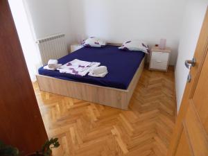 Posteľ alebo postele v izbe v ubytovaní Apartment Leporiz