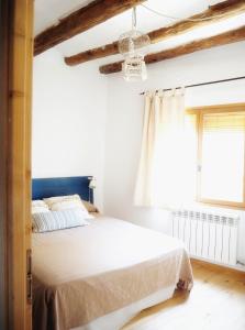 Cama o camas de una habitación en Casa Les Germanes
