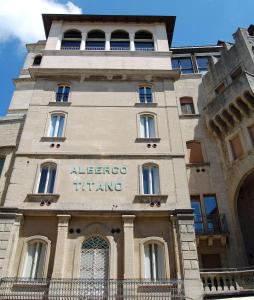 a building with a sign on the side of it at Hotel Titano in San Marino