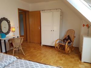 a bedroom with a bed and a table and chairs at Ferien-& Monteurwohnung Koenen2 nah am Westfield Centro in Oberhausen
