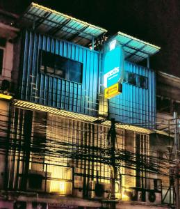 a blue building with a sign in front of it at Zeds Hostel Bangkok in Bangkok