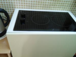 a microwave oven sitting on top of a counter at Hostel Little in Kostroma