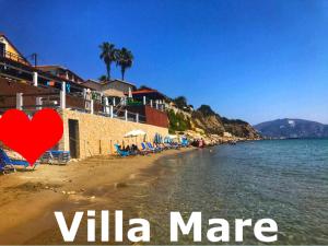 a view of a beach with a red heart at Villa Mare Zakynthos, private in Laganas