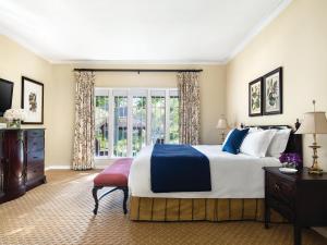 a bedroom with a large bed and a window at The Langham Huntington, Pasadena in Pasadena