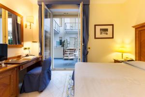 Łóżko lub łóżka w pokoju w obiekcie Hotel Continental