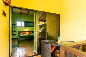 Postel nebo postele na pokoji v ubytování Hotel Boutique La Casa de las Flores