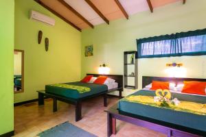 Postel nebo postele na pokoji v ubytování Hotel Boutique La Casa de las Flores