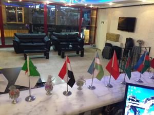 a table with flags on it in a room at Florin Hotel in Istanbul