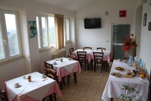 Reštaurácia alebo iné gastronomické zariadenie v ubytovaní B&B Severini