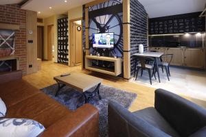 TV a/nebo společenská místnost v ubytování Hotel Passpartù Home Garni