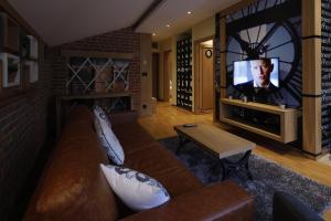TV a/nebo společenská místnost v ubytování Hotel Passpartù Home Garni