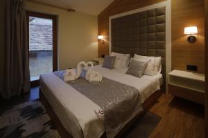 Postel nebo postele na pokoji v ubytování Hotel Passpartù Home Garni
