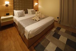 Postel nebo postele na pokoji v ubytování Hotel Passpartù Home Garni