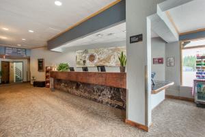 a lobby with a reception desk in a building at The Vintage Hotel in Winter Park