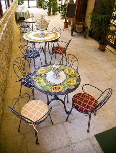 a group of tables and chairs in a patio at Belvedere San Nicola in Erice