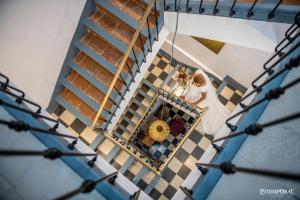 a bride walking down the stairs at her wedding at La Casa Grande de Zujaira in Zujaira