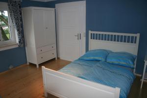 Ένα ή περισσότερα κρεβάτια σε δωμάτιο στο Ferienhaus Ampflwang