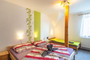 Ein Bett oder Betten in einem Zimmer der Unterkunft Penzion Agáta