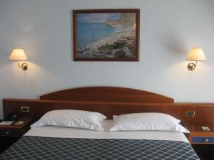 Postelja oz. postelje v sobi nastanitve Hotel Levante