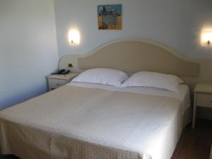 Postelja oz. postelje v sobi nastanitve Hotel Levante