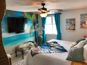 a bedroom with a bed and a flat screen tv at 2 Bedroom , 2 Bath , Villa in Oldsmar
