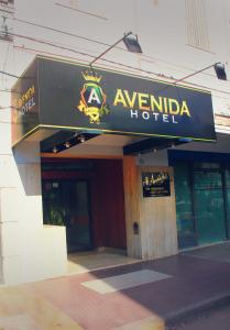 aania hotel sign on the front of a building at Avenida Hotel in Junín