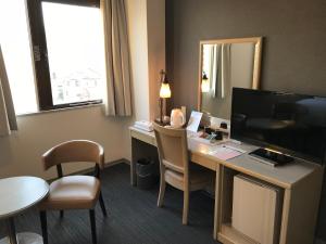 TV a/nebo společenská místnost v ubytování Chisun Hotel Kamata