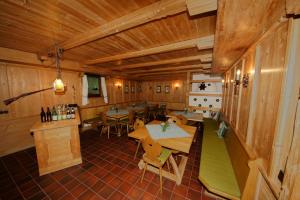an overhead view of a room with tables and chairs at Gästehaus Funk in Bad Feilnbach