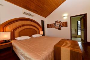 Postel nebo postele na pokoji v ubytování Hotel Paradis d'Ouvéa