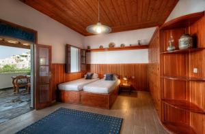 A bed or beds in a room at Thea Villas and Suite