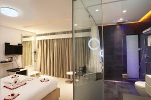 Кровать или кровати в номере Fahrenheit Hotels & Resorts