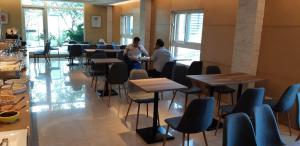 two people sitting at tables in a restaurant at New California in Xindian +40 photos