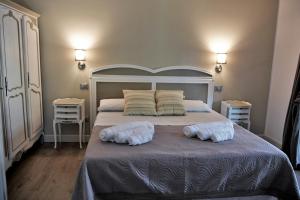 Ліжко або ліжка в номері Il Casale Della Gioia