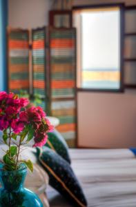 A bed or beds in a room at Thea Villas and Suite